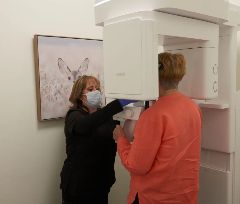 A patient having a 3D scan taken for guided implant placement